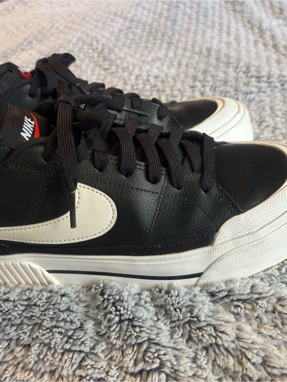 Nike Black Leather Low-Top Sneakers with White Swoosh and White Sole